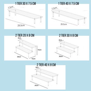 May include: Diagrams of clear acrylic display stands with metal legs. The image shows single-tier stands, 30 cm and 40 cm long, and two-tier stands, 20 cm, 30 cm, and 40 cm long. Measurements are in centimeters.