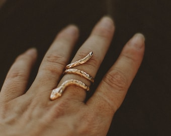 serpentine. a bohemian gold snake ring with etchings.