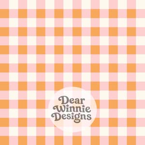 May include: A repeating gingham pattern featuring alternating squares of soft pink, bright orange, and cream. A circular white overlay in the lower center displays the dark brown text Dear Winnie Designs in a stylized, rounded serif font.