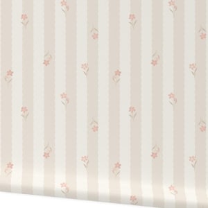 May include: A roll of wallpaper featuring a repeating pattern of vertical stripes in cream and beige. Delicate pink floral accents are scattered across the design, adding a touch of elegance. The wallpaper is ideal for adding a classic touch to any room.