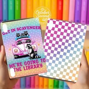 May include: Two phone cases are displayed. One features a pink car with raccoons and the text "Get in Scavenger, We're Going to the Library." The other case has a checkered pattern in shades of pink, purple, and blue.