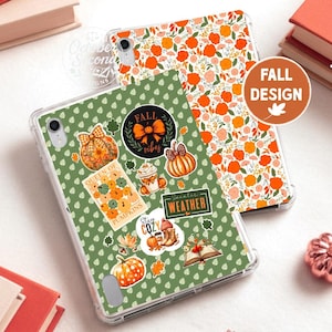 May include: Two clear tablet cases featuring autumn-themed designs. One case has a green background with a repeating leaf pattern and various fall stickers including pumpkins, a coffee cup, and text reading "QUEEN OF PUMPKINS" and "SWEATER WEATHER". The other case has a white background with a dense pattern of orange and peach flowers.