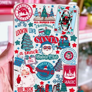May include: A clear phone case with a festive Christmas design. The case features various holiday-themed illustrations, including Santa Claus, Christmas trees, and the text "All Booked for Christmas". The design incorporates red, green, and blue colors.
