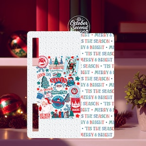 May include: White Christmas-themed refrigerator magnet with various festive illustrations and text. The design includes Santa Claus, Christmas trees, and the phrases "Merry & Bright" and "'Tis the Season."