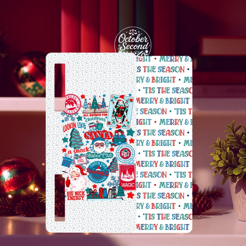 May include: White Christmas-themed refrigerator magnet with various festive illustrations and text. The design includes Santa Claus, Christmas trees, and the phrases "Merry & Bright" and "'Tis the Season."