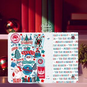 以下が含まれることがあります： サンタクロース、クリスマスツリー、ギフトボックスなど、さまざまなお祝いのグラフィックが施された、白を基調としたクリスマスをテーマにしたアクセサリーです。「LOOKIN LIKE SANTA」や「MERRY & BRIGHT」などのテキスト要素が含まれています。