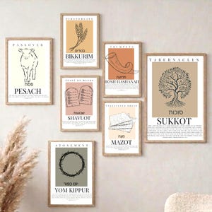 May include: A collection of framed art prints featuring minimalist designs and text related to Jewish holidays. Each print has a neutral color palette and includes English and Hebrew text. The prints depict symbols like wheat, a shofar, and a crown of thorns.