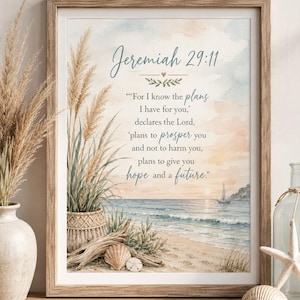 May include: A framed wall art print featuring a coastal beach scene with pampas grass, driftwood, and seashells. The text reads: Jeremiah 29:11, 'For I know the plans I have for you,' declares the Lord, 'plans to prosper you and not to harm you, plans to give you hope and a future.'