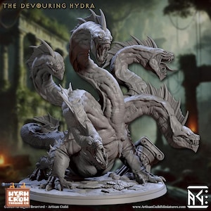 May include: A detailed, gray miniature of a multi-headed hydra monster. The sculpture features five snarling heads with sharp teeth, a muscular body, and a textured base. The text "THE DEVOURING HYDRA" is at the top.