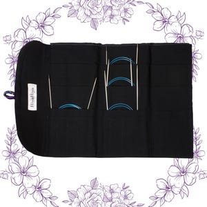 May include: Black fabric knitting needle case with multiple pockets holding various sizes of blue circular needles and straight needles. The case has a label that reads "HiyaHiya". The case is open and displayed against a white background with floral accents.