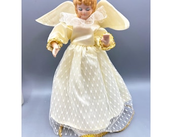 Figura navideña musical de ángel de los años 80, color crema, satén, encaje y detalles dorados, de 24 cm (9,5 pulgadas).