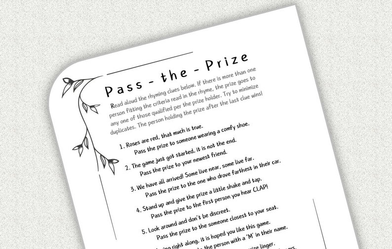 May include: A black and white printable game card with the title "Pass the - Prize". The card includes instructions and a list of five rhyming clues for a game.