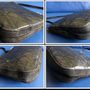 May include: A black quilted leather shoulder bag with a denim trim. The bag has a flap closure and a chain strap.