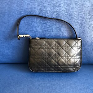 May include: A black quilted leather handbag with a silver chain strap.