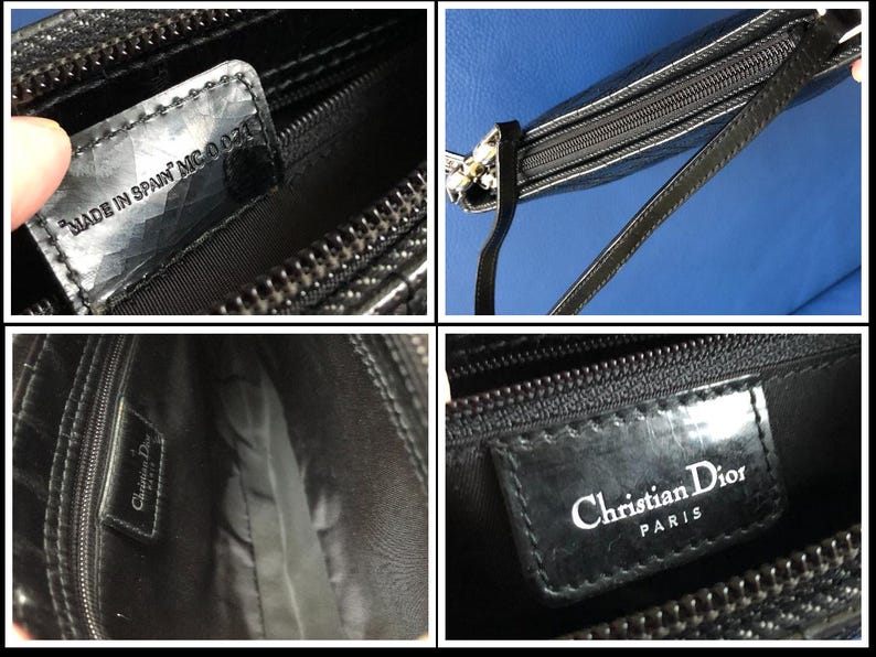May include: Black leather purse with a silver clasp and a zipper closure. The purse has a black leather strap and a label that reads "Christian Dior Paris" and "Made in Spain MC 0027".