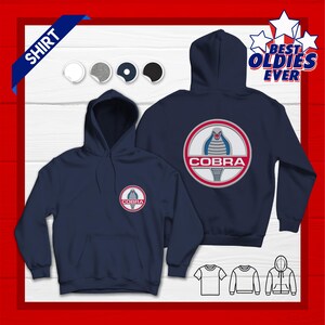 May include: Navy blue hooded sweatshirt featuring the Cobra logo on the front and back. The logo is a red and white circular emblem with a cobra snake design. The sweatshirt has a front pocket and a hood. The text "BEST OLDIES EVER" is on the top right.
