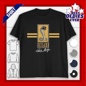 May include: Black t-shirt with a gold and black cobra emblem, the text "G.T.500", and "Carroll Shelby". Two gold horizontal stripes are also present. The shirt is labelled "Shirt" and "Best Oldies Ever".
