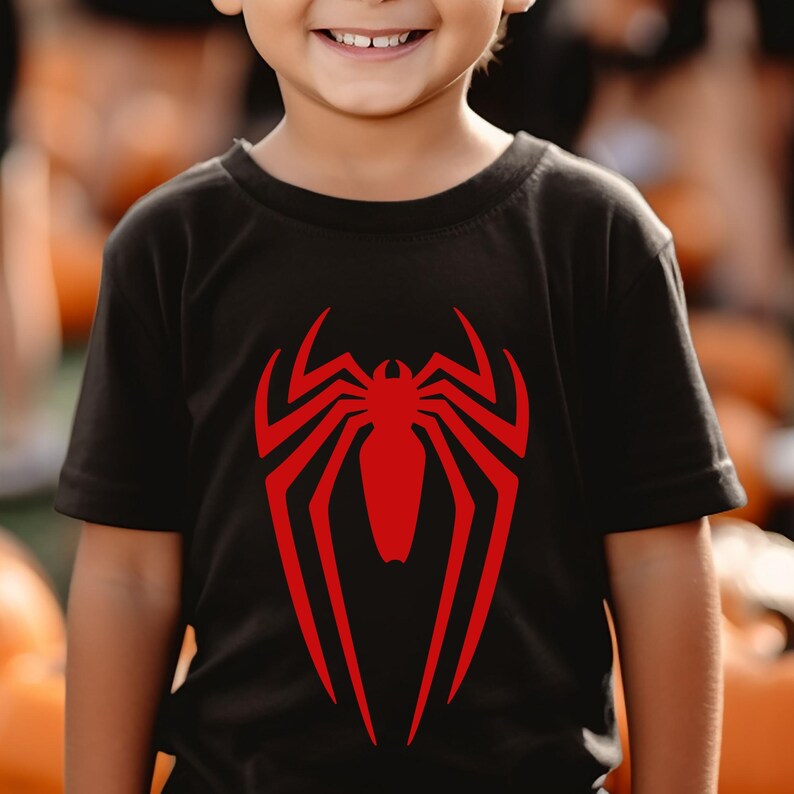 May include: A black t-shirt with a red Spiderman logo on the front.