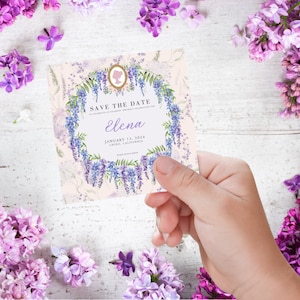 May include: Save the date card with a watercolor wreath of purple wisteria flowers. The card is decorated with a silhouette of a woman's head and the text "Save the Date" in a decorative font. The card also includes the name "Elena", the date "January 13, 2024", and the location "Chino, California".