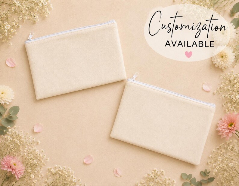 May include: Two rectangular, cream-colored zippered pouches with a smooth, solid-colored surface. A white oval graphic in the upper right corner contains the black text Customization AVAILABLE with a small pink heart icon below the text.