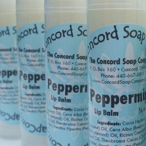 May include: Four tubes of peppermint lip balm with blue and white labels. The labels read "The Concord Soap Company", "Peppermint Lip Balm", and list the ingredients.