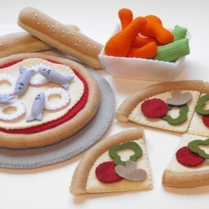 May include: Felt food play set with a pizza, breadsticks, chicken nuggets, and vegetables. The pizza is divided into slices and has different toppings, including pepperoni, mushrooms, and peppers. The breadsticks are long and thin, and the chicken nuggets are orange. The vegetables are green and yellow.