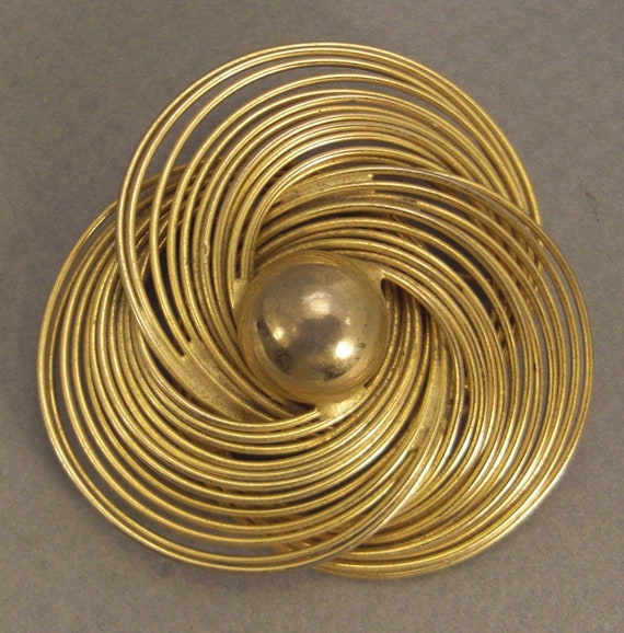 Spiral brooch sale