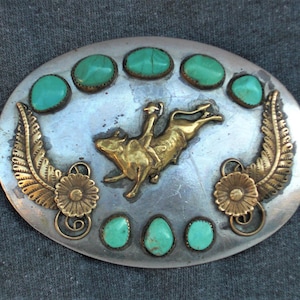 SOUTHWESTERN  BUCKLE,,  COWBOY buckle,Turquoise Stones, Silvertone relief , Bronco cowboy,,app 4 x3 in