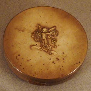 COMPACT Brass Cupid  Roger Gallet USA relief design goldtone app 3 in diam