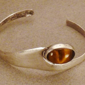 MEXICAN MODERNISM BRACELET Cuff  Sterling silver signed by artist 2 1/2 in diameter 1 in wide