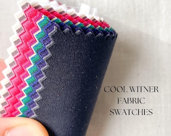 May include: A close-up of fabric swatches in various colors and patterns. The swatches are folded in a fan shape and labeled "COOL WITNER FABRIC SWATCHES".