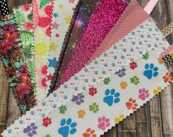 Misc themed Fabric Bookmarks include space, paw prints, plain colors, and plants
