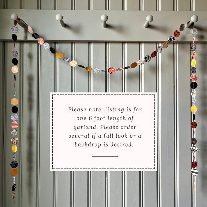 May include: A decorative garland featuring circular and oval fabric pieces in various patterns and colors, strung together. The garland is approximately 6 feet long. The text in the image reads: "Please note: listing is for one 6 foot length of garland."