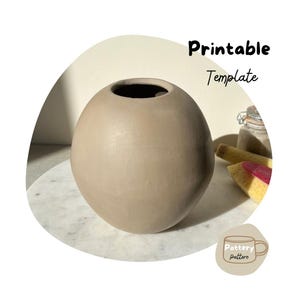 May include: Printable pottery template for a round vase. The template is shown on a white marble surface.
