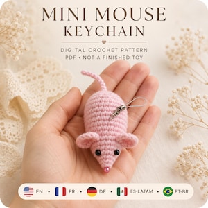 May include: A light pink crocheted mouse keychain with black bead eyes and a small pink bead nose. The text reads MINI MOUSE KEYCHAIN, DIGITAL CROCHET PATTERN, PDF, NOT A FINISHED TOY. It includes a silver metal lobster clasp and a thin cord.