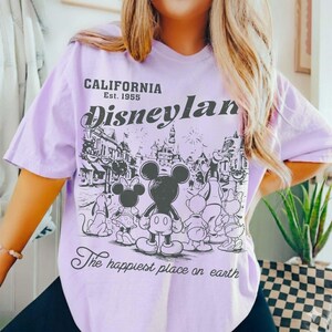 May include: A set of three ceramic mugs with a speckled, matte finish. The mugs are in shades of cream, light gray, and dark gray. Each mug has a simple, minimalist design and a rounded handle.