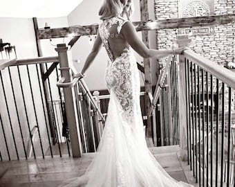 Beautiful lace mermaid nude wedding dress. Sexy deep V neck wedding dress. Custom wedding dress for bride.