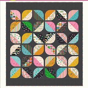 May include: A quilt pattern titled Primrose by Copper Kettle Quilt Company. The design features a grid of dark gray squares, each containing a colorful, patterned leaf-like shape in various prints including stripes, dots, and sewing motifs.