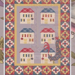 May include: A quilt pattern featuring a village scene with six houses, each with a different colored roof. The houses are set against a light purple background, with a rooster and the text "Village" and "by Coach House Designs".