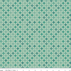 May include: A fabric with a repeating pattern of teal and dark teal floral and cross designs on a light green background. The fabric is measured in inches along the bottom edge.