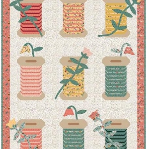 May include: A quilted fabric featuring nine spools of thread, each with a floral design and a flower on top. The spools are in various colors, including red, yellow, and green, set against a dotted background with a floral border.