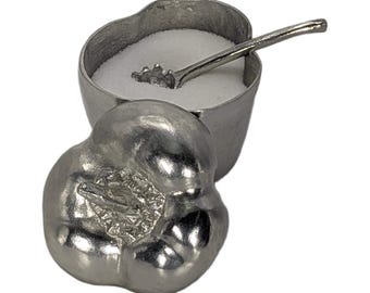 May include: A silver-toned metal sugar bowl shaped like a bell pepper with a removable lid. The bowl is filled with white granulated sugar and includes a small matching silver-toned metal spoon resting inside the container.