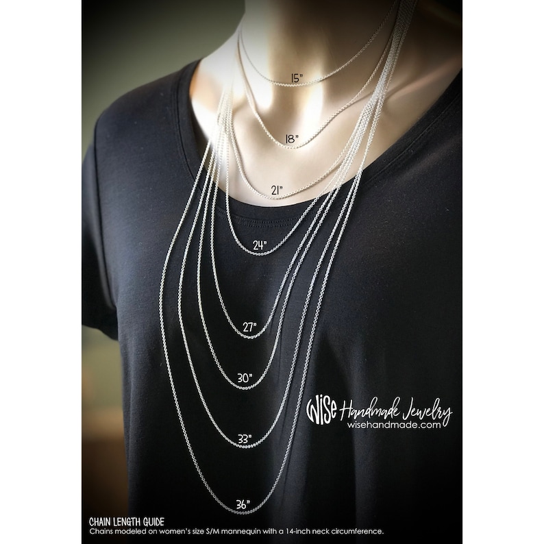 May include: A black t-shirt displays a chain length guide with necklaces of varying lengths, from 15 inches to 36 inches. The guide is modeled on a mannequin with a 14-inch neck circumference. The Wise Handmade Jewelry logo is visible.