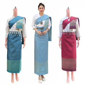 May include: Three outfits consisting of a white long-sleeved shirt and a long, patterned wrap skirt in teal, light blue, or magenta. Each set includes a matching shoulder drape, a metallic waist belt with floral accents, and a silver-toned necklace.