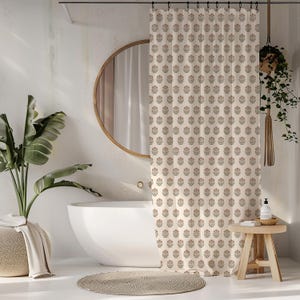 May include: Cream-colored floral patterned shower curtain in a bathroom setting. The curtain features a repeating pattern of stylized flowers in muted red and green. A round mirror and a white bathtub are also visible.