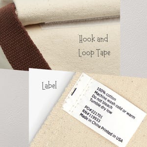 May include: Close-up of a canvas bag with a brown strap and hook and loop tape closure. A label displays care instructions and the text "Made in China Printed in USA". The bag is made of 100% cotton.