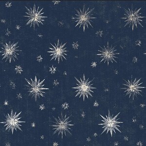 May include: A navy blue background with a repeating pattern of white starbursts in various sizes. The stars have a textured, hand-drawn appearance, creating a celestial or cosmic theme. The design is suitable for fabric, wallpaper, or other decorative applications.