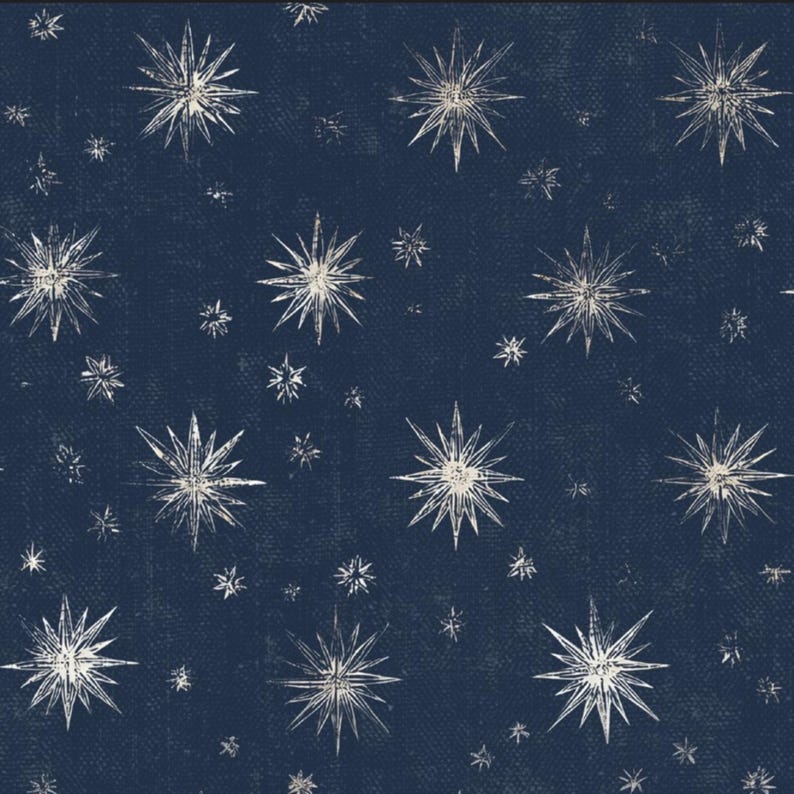 May include: A navy blue background with a repeating pattern of white starbursts in various sizes. The stars have a textured, hand-drawn appearance, creating a celestial or cosmic theme. The design is suitable for fabric, wallpaper, or other decorative applications.