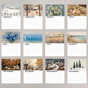 May include: A 2024 wall calendar featuring twelve monthly pages, each displaying a unique seasonal watercolor illustration above a grid of dates. The artwork depicts various landscapes, animals, and floral scenes corresponding to the months of the year.