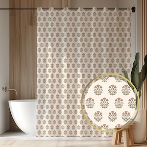 May include: Cream-colored shower curtain with a repeating floral pattern in muted red and green. The curtain is hanging in a bathroom setting, with a white bathtub and wooden accents visible.